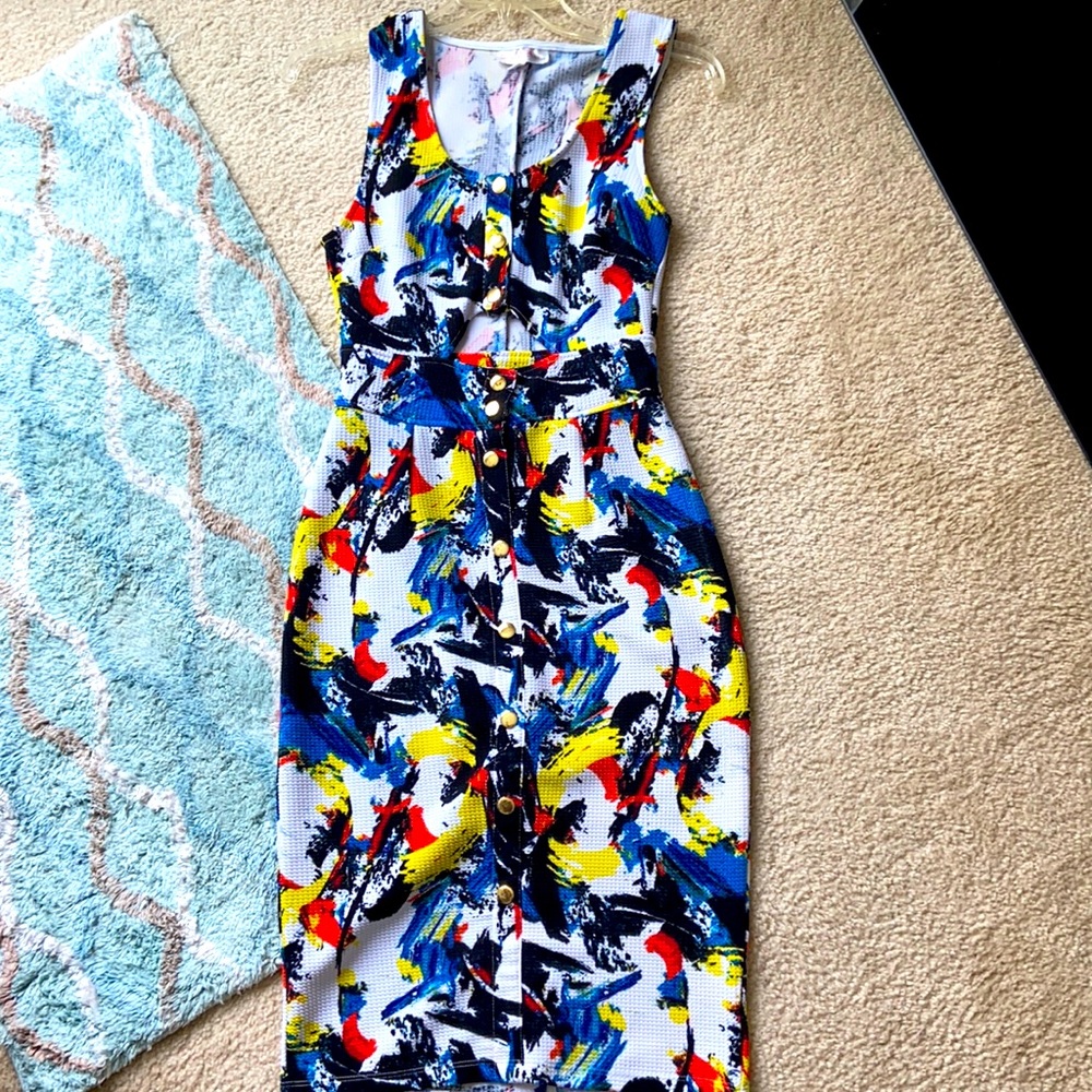 Small dress white with splash colors & gold snaps.